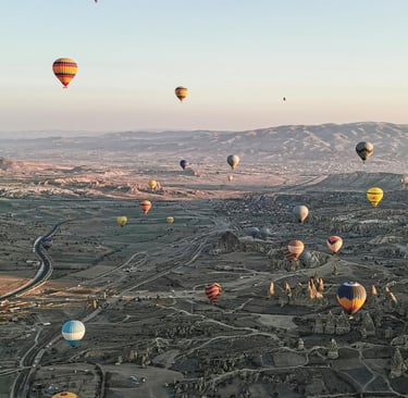  balloons are flying in the air at Fairy chimneys Cappadocia