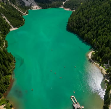 a lake with a boat on it and a boat in the water
