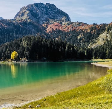 a lake with a mountain in the background