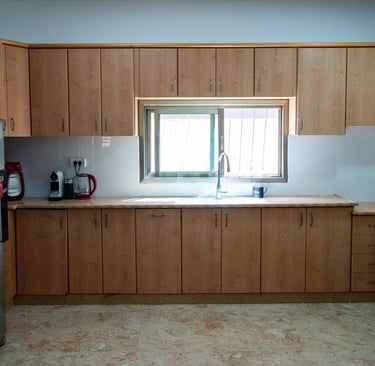 a kitchen with a refrigerator and a refrigerator freezer