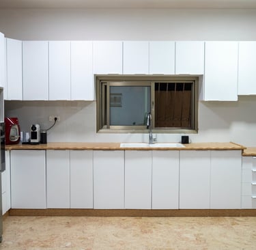 a kitchen with a refrigerator and a refrigerator freezer