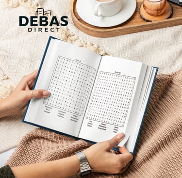 Relaxing scene with Debas Direct puzzle books and coffee cup on beige background.