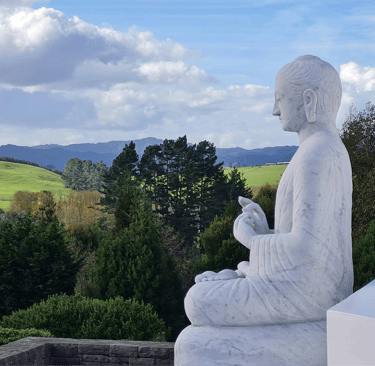 Statue overlooking nature — symbol of reflection and feminine sovereignty
