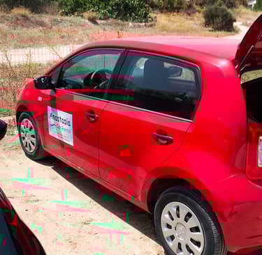 Anastasia's Rental Car in Milos Greece- red small car