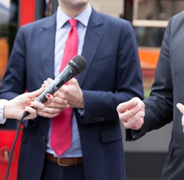 business-executives-answer-news-media-questions-at-impromptu-news-interview