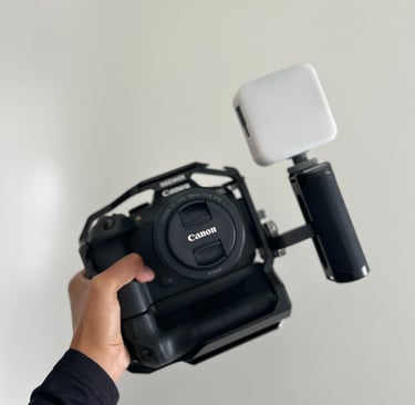 a person holding a camera and a camera