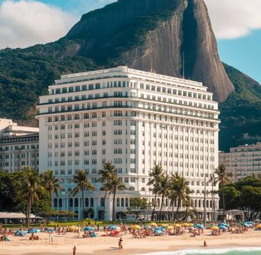 Copacabana Palace luxury hotel on the beach in Rio de Janeiro with Sugarloaf Mountain backdrop.