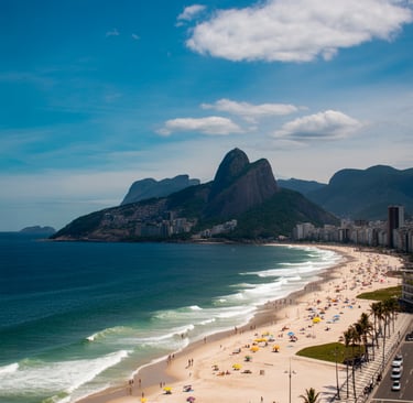 Aerial view of Ipanema Beach in Rio de Janeiro with Two Brothers Mountain in the background.