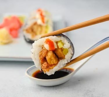 Fresh nigiri sushi pieces on wooden board at high-end Tokyo restaurant