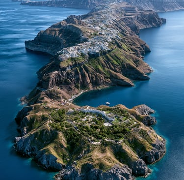Aerial view of Santorini island cliffs with white houses overlooking the blue Aegean Sea.