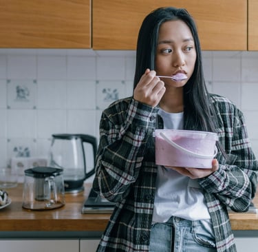 Photo by Alena Darmel: https://www.pexels.com/photo/sad-woman-eating-ice-cream-6643006/