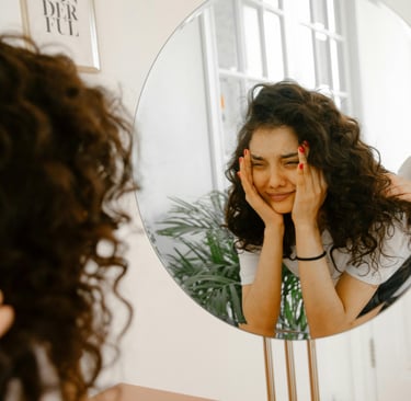 Photo by Polina Zimmerman: https://www.pexels.com/photo/upset-woman-looking-in-mirror-3958779/