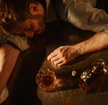 Photo by TREEDEO.ST  : https://www.pexels.com/photo/man-in-shirt-sleeping-after-drinking-whiskey-169
