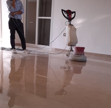 Polishing a marble floor for a high reflective shine to finish.