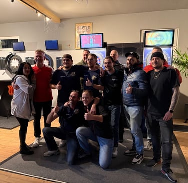 a group of people standing around a room