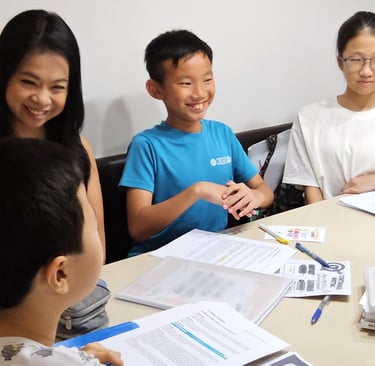 Thriving Kids Club Founder Mrs Serene Wee and students at English Tuition Class