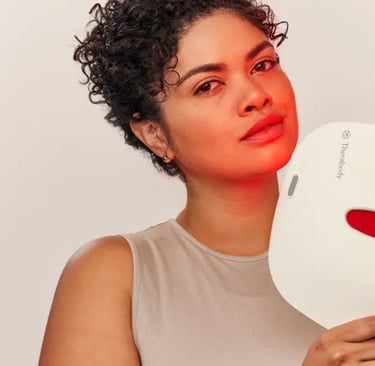 a woman with a red heart shaped mask on her face