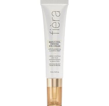 a white and gold tinted eye cream with a gold and white background