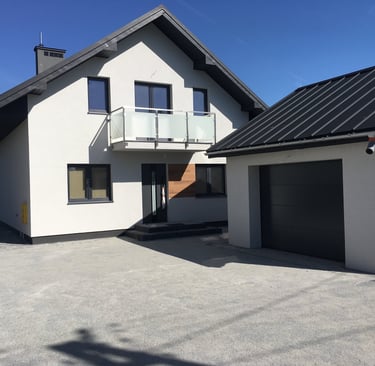 a house with a garage door and a garage door