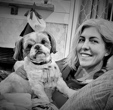 woman holding dog and smiling