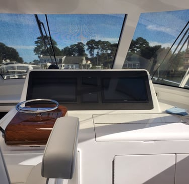Yacht helm station with electronics and controls