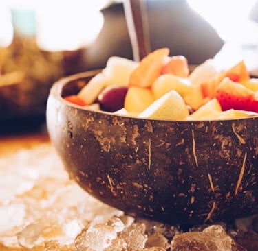 a fruit salad in a coconut bowl