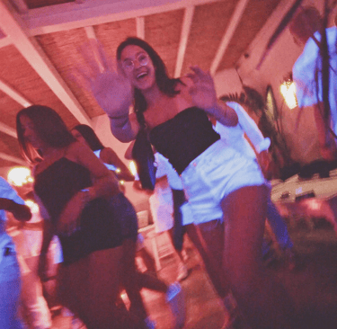 People dancing at a beach party