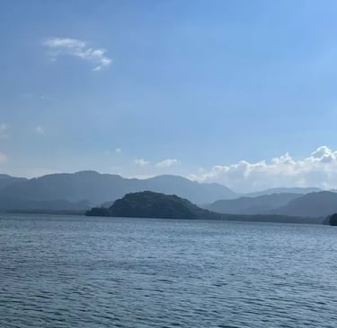 a boat is sailing on Lago de Yojoa Honduras