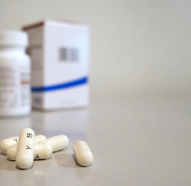 pills and pills on a table with a box of pills