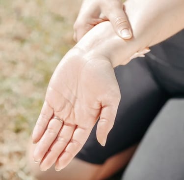 a woman holding her hand out to show off her hand