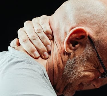 a bald balding man with glasses and a white shirt