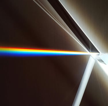 a prism disperses light by refraction causing a rainbow of colours