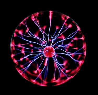 a plasma globe operating showing violet streamers and red patches