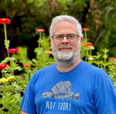 Jason with zinnia flower bed