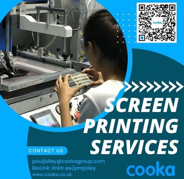 a woman is looking at a screen printing on a computer