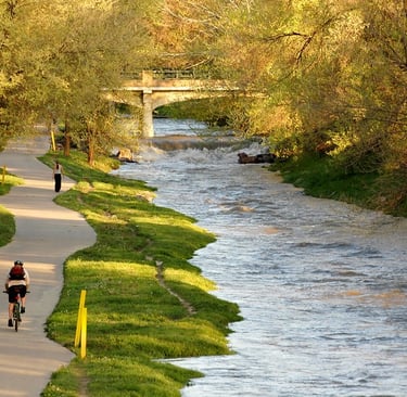 Cyclist and walker on the Los Angeles River Bike Path
