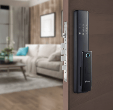 Modern smart door lock with biometric fingerprint scanner and digital keypad on a wooden home entrance.