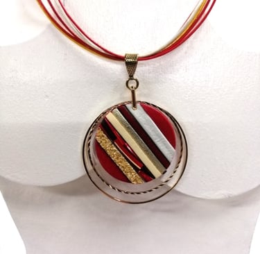 a necklace with a red and white striped necklace