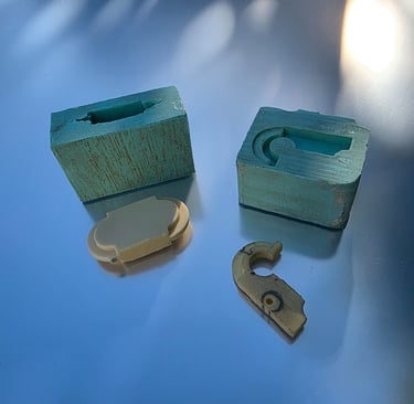LaPenna lamp bracket fast-cast urethane with silicone mold and wood mock-up clasp