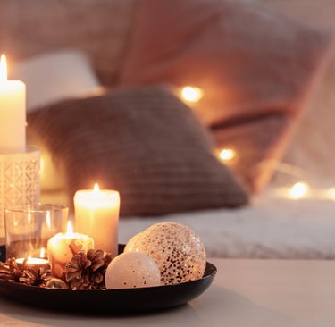 candles and candles are on a table with candles