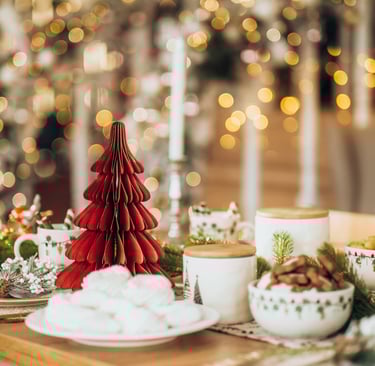 a table with a christmas tree and a christmas tree
