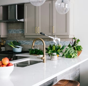 a kitchen with a bowl of fruit and vegetables