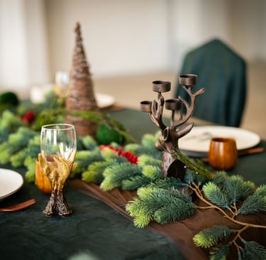 a table with a table setting with a candle and candles