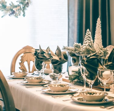 a table setting with a chandelier and a chandelier
