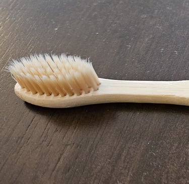 My bamboo toothbrush. An example of my commitment to sustainability.