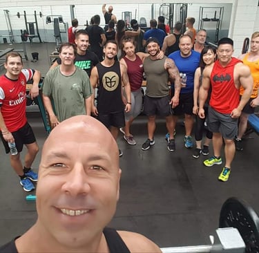 A happy group of PT client with their coach