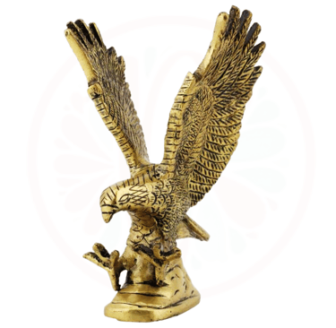 a golden eagle statue of a bird with wings spread out