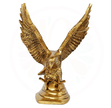 a golden eagle statue of a bird with a skull and a skull on it