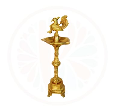a gold colored candle holder with a rooster on it