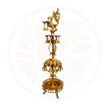 a tall brass bellows with bells and bells